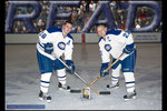 Men's Hockey Team, represented by Jake Bayley ('06) and Greg Osborne ('07) by Adam Musial